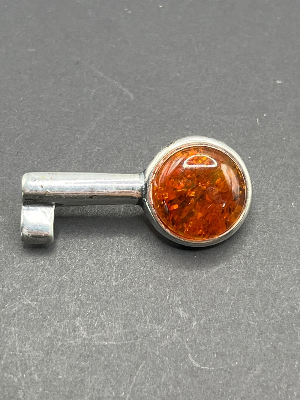Sterling silver Amber key brooch marked 925 and tested Sterling Silver